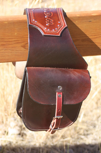 leather saddle pockets with carved initials