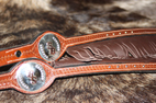 roping reins, 8 foot in length with fringe, nickle silver spots and silver conchos with copper initials
